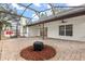 Covered patio with brick pavers and fire pit, viewed from the exterior at 1316 Hampshire Place Cir, Altamonte Springs, FL 32714