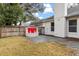 Private backyard with a unique red fire pit area and a wooden fence at 1316 Hampshire Place Cir, Altamonte Springs, FL 32714