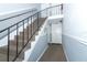 Carpeted stairs with metal railing leading to condo entrance at 143 Lewfield Cir # 143, Winter Park, FL 32792