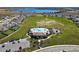 Resort-style pool, clubhouse and playground surrounded by homes at 14568 Crestavista Ave, Clermont, FL 34714