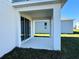 Covered patio with sliding glass doors, perfect for outdoor relaxation at 14568 Crestavista Ave, Clermont, FL 34714