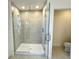 Modern bathroom with a spacious walk-in shower and tile walls at 14568 Crestavista Ave, Clermont, FL 34714