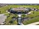 Community clubhouse with pool, playground, and lush landscaping at 14568 Crestavista Ave, Clermont, FL 34714