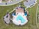 Zero-entry pool with a playground and shaded areas at 14568 Crestavista Ave, Clermont, FL 34714