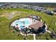 Community pool with a water slide and plenty of space for lounging at 14568 Crestavista Ave, Clermont, FL 34714