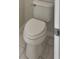 Clean and functional bathroom with a standard toilet and tiled floor at 148 Harwood Cir, Kissimmee, FL 34744