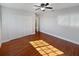 Spacious bedroom with wooden floors and ample natural light at 148 Harwood Cir, Kissimmee, FL 34744