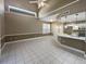 Kitchen and dining area with white cabinetry, granite counters, and high ceilings at 148 Harwood Cir, Kissimmee, FL 34744