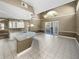 Bright kitchen with white cabinets, granite countertops, and pool access at 148 Harwood Cir, Kissimmee, FL 34744