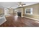 Open living room with wood floors, fireplace, and ample natural light at 148 Harwood Cir, Kissimmee, FL 34744