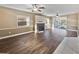 Living room featuring a fireplace, wood floors, and access to the pool area at 148 Harwood Cir, Kissimmee, FL 34744