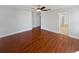 Large main bedroom with wood-look floors and an ensuite bathroom at 148 Harwood Cir, Kissimmee, FL 34744