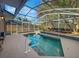Inviting pool with a screened enclosure, perfect for relaxation at 148 Harwood Cir, Kissimmee, FL 34744