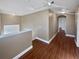Upstairs hallway with wood flooring and access to the bedrooms at 148 Harwood Cir, Kissimmee, FL 34744