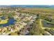Large residential community from above with numerous houses, lakes, and trees at 1942 Willow Wood Dr, Kissimmee, FL 34746