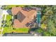 Top-down aerial view showcasing the home's roof and pool at 1942 Willow Wood Dr, Kissimmee, FL 34746