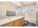 Bathroom with dual sinks, a bathtub, and tile flooring at 1942 Willow Wood Dr, Kissimmee, FL 34746