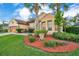 Beautiful one-story home with mature landscaping and a two-car garage at 1942 Willow Wood Dr, Kissimmee, FL 34746