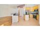 Kitchen with wood floors, stainless appliances and island counter at 1942 Willow Wood Dr, Kissimmee, FL 34746