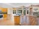 Kitchen with island, stainless steel appliances, and wood cabinets at 1942 Willow Wood Dr, Kissimmee, FL 34746