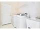 Laundry room with washer, dryer, and utility sink at 1942 Willow Wood Dr, Kissimmee, FL 34746