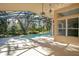 Screened-in pool and patio area surrounded by lush landscaping at 1942 Willow Wood Dr, Kissimmee, FL 34746