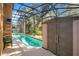 Relaxing screened-in pool area with storage shed at 1942 Willow Wood Dr, Kissimmee, FL 34746