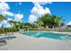Resort-style community pool with a splash pad, hot tub, and ample seating at 244 Villa Domani Cir, Davenport, FL 33896