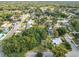 Aerial view of a property nestled among trees in a residential neighborhood at 3109 Williams St, Orlando, FL 32806