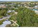 Elevated perspective of a house among trees in a neighborhood with a city view at 3109 Williams St, Orlando, FL 32806
