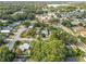 A high-angle view of a residential area with houses surrounded by trees and streets at 3109 Williams St, Orlando, FL 32806