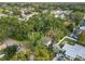 Aerial view showcasing a house surrounded by lush trees in a residential area at 3109 Williams St, Orlando, FL 32806