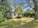 Cozy single-story residence with a fenced backyard surrounded by trees at 3109 Williams St, Orlando, FL 32806