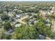 An aerial view of a neighborhood with houses, streets, and green trees at 3109 Williams St, Orlando, FL 32806