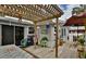 Spacious backyard deck with pergola, table, chairs, and lush landscaping at 431 Perdita Ave, Edgewater, FL 32132