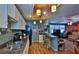 Bright kitchen with white cabinets, granite counters, and breakfast bar at 431 Perdita Ave, Edgewater, FL 32132