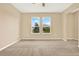 Spacious bedroom with carpet and large windows at 440 Alcove Dr, Groveland, FL 34736