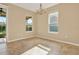 Bright dining room with tile floors and access to a patio at 440 Alcove Dr, Groveland, FL 34736