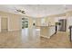 Spacious kitchen with island, stainless steel appliances, and granite countertops at 440 Alcove Dr, Groveland, FL 34736