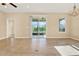 Open living room with sliding doors leading to the backyard at 440 Alcove Dr, Groveland, FL 34736