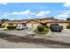 Community of tan townhomes with garages and parking at 707 Carpenters Way # 45, Lakeland, FL 33809