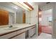 Double sink bathroom with mirrored vanity and shower at 707 Carpenters Way # 45, Lakeland, FL 33809