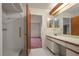 Bathroom with double vanity and walk-in shower at 707 Carpenters Way # 45, Lakeland, FL 33809