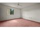 Bedroom with ceiling fan and large window at 707 Carpenters Way # 45, Lakeland, FL 33809