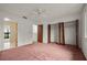 Bedroom with carpet, ceiling fan and a closet at 707 Carpenters Way # 45, Lakeland, FL 33809