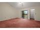 Spacious bedroom with balcony access and ample closet space at 707 Carpenters Way # 45, Lakeland, FL 33809