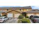 Condo exterior with attached garage and landscaping at 707 Carpenters Way # 45, Lakeland, FL 33809