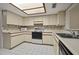 Bright kitchen with white cabinets and appliances at 707 Carpenters Way # 45, Lakeland, FL 33809