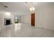Spacious living room with fireplace and tile floors at 707 Carpenters Way # 45, Lakeland, FL 33809