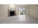 Living room with fireplace and sliding glass doors at 707 Carpenters Way # 45, Lakeland, FL 33809